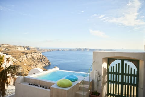 An infinity pool, sun loungers