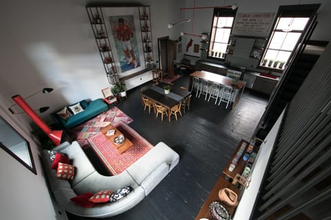 Shot of living, dining, and kitchen from mezzanine