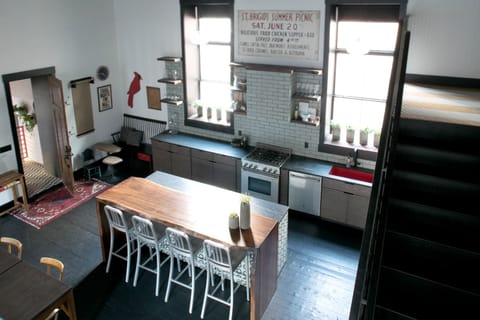 Shot of kitchen, breakfast nook, and apartment entrance