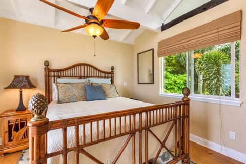 Upper lanai bedroom suite with private bathroom and queen bed.