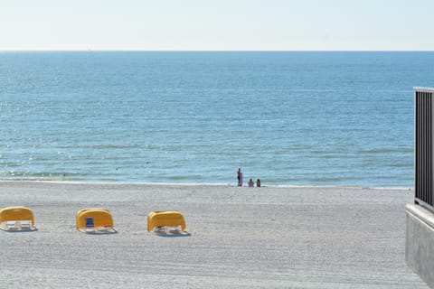 On the beach, sun loungers, beach towels