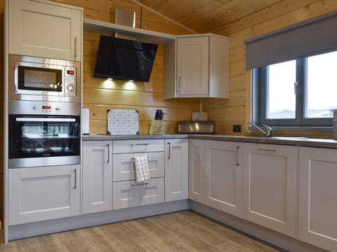 Fully equipped kitchen within the open-plan design | Larch Lodge, Cedar Lodge - Dale Garth Lodges, Ulverston