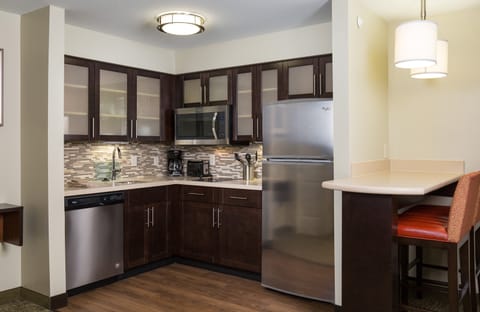 Curb your appetite by cooking a meal in your kitchen.