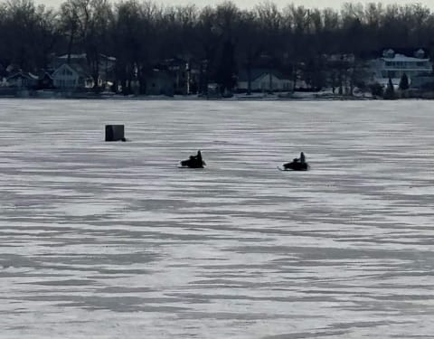 Ice fishing and snowmobiling! Always fun on the lake.