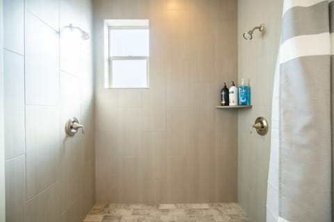 Combined shower/tub, hair dryer, towels, soap