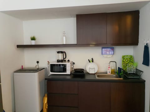 Fridge, microwave, electric kettle, cookware/dishes/utensils