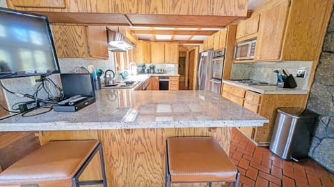 From the Entry, on the left is the Kitchen with 2 seats at the bar