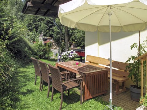 Plant, Furniture, Property, Plant Community, Table, Shade, Outdoor Table, Chair, Outdoor Furniture, Umbrella