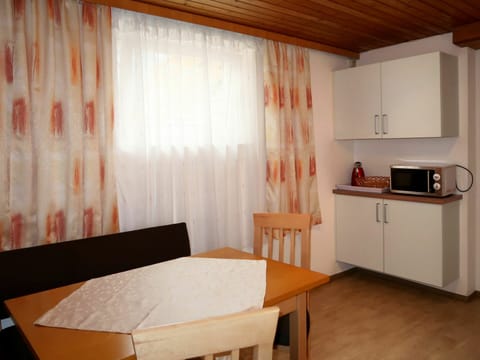 Table, Furniture, Property, Cabinetry, Building, Wood, Interior Design, Comfort, Curtain, Countertop