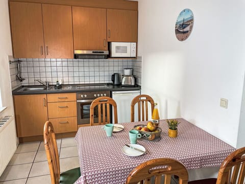 Cabinetry, Furniture, Property, Countertop, Chair, Table, Wood, Interior Design, Lighting, Kitchen Stove