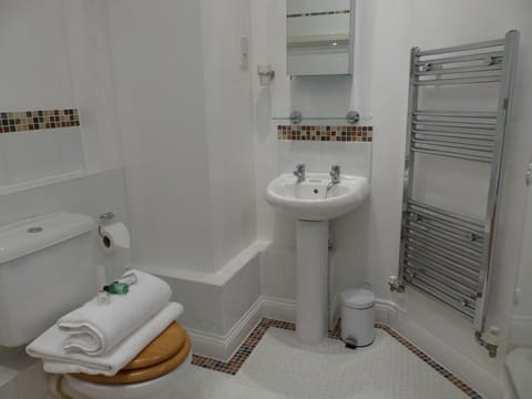 Combined shower/tub, hair dryer, towels, soap