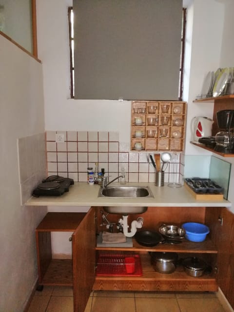 Fridge, coffee/tea maker, electric kettle, cookware/dishes/utensils