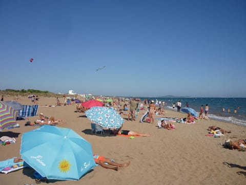 On the beach, sun loungers