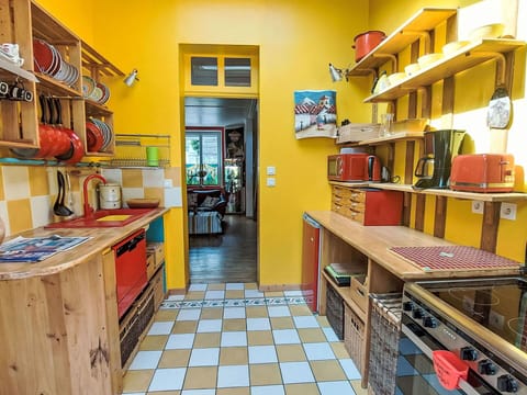 Interior Design, Yellow, Kitchen, Flooring, Furniture, Floor, Room, Shelf, Shelving, Countertop