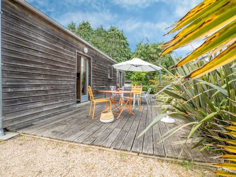 Property, Plant, Sky, Cloud, Building, Shade, Outdoor Furniture, Wood, Umbrella, Tree