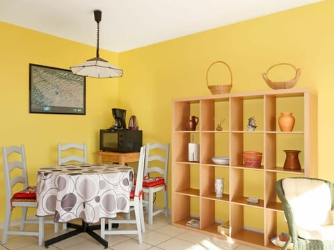 Yellow, Room, Furniture, Interior Design, Orange, Wall, Shelf, Ceiling, Table, Building