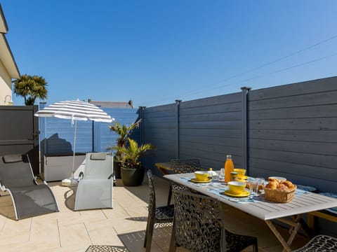 Sky, Food, Table, Property, Furniture, Flowerpot, Plant, Outdoor Furniture, Tableware, Shade