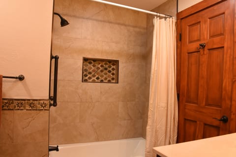 Combined shower/tub, hair dryer, towels, soap