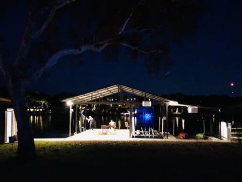Dock lit up at night.