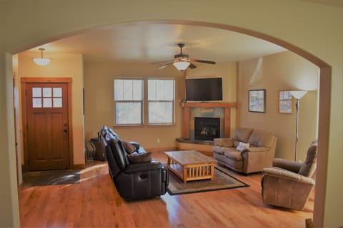 LR - gas fireplace, recliner, love seat, & leather couch with 2 recliners