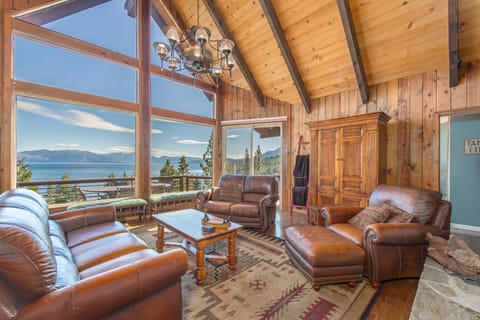 Family Room with panoramic lake views, wood burning fire place, access to deck