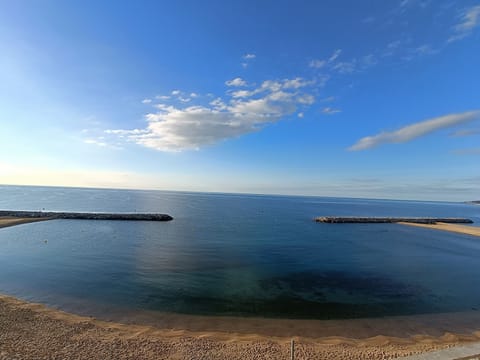 On the beach, sun loungers, beach towels