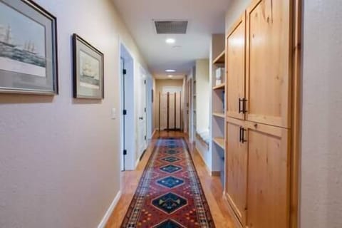 hallway with jack and jill bedrooms and bath