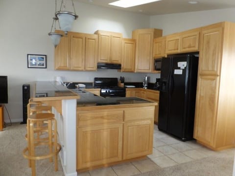Fully furnished kitchen with eating bar