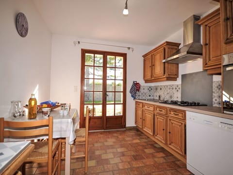 Furniture, Kitchen, Flooring, Interior Design, Cabinetry, Wood, Countertop, Floor, Room, Ceiling