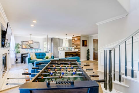 Regulation size foosball table in the side nook of the living room.