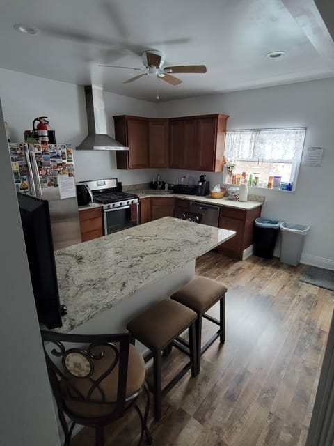 There is seating for 5 around the kitchen island. 