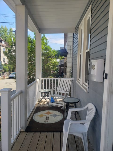 Chairs and ash trays on the front porch.
