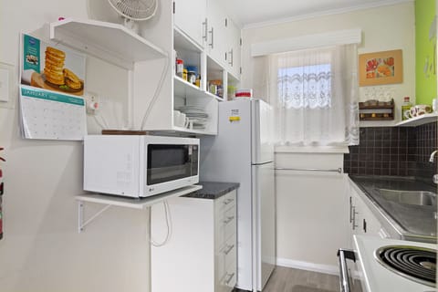 Fridge, microwave, toaster, cookware/dishes/utensils