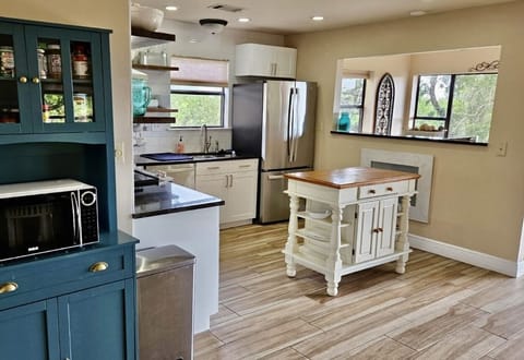 Enter into the spacious, open kitchen and living area