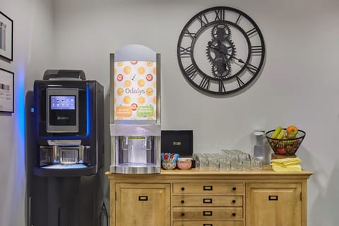 Help yourself to fresh juice, hot beverages, and light bites at the refreshment station.