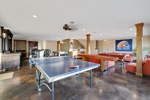 Game room w/ pool table, shuffleboard, air hockey, ping pong table & Ms. Pac-man
