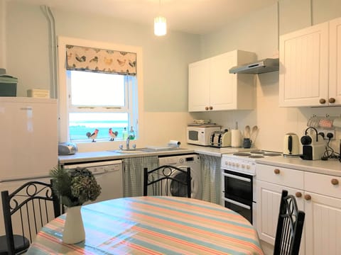 Even washing up is a pleasure in this kitchen, with great Loch views!