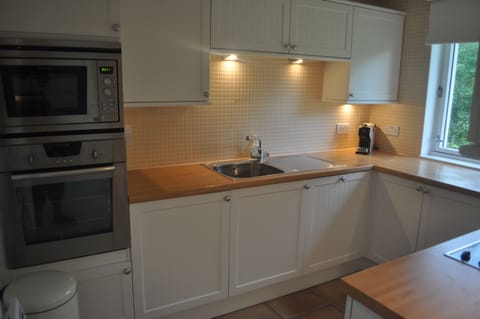 Kitchen with micro, oven, coffee machine, waste disposal etc