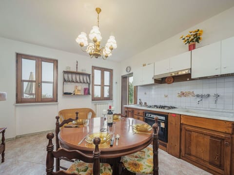 Table, Furniture, Property, Cabinetry, Wood, Countertop, Interior Design, Lighting, Picture Frame, Chair