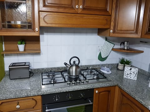 Fridge, coffee/tea maker, cookware/dishes/utensils