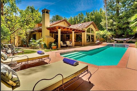 Heated pool AND JACUZZI.  COULD BE CONVERTED TO SALT POOL