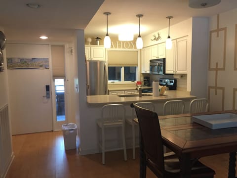 An updated full kitchen is just inside the front door.