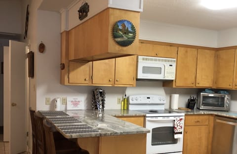 Microwave, dishwasher, coffee/tea maker, cookware/dishes/utensils