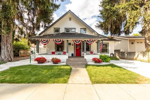 Front of home with rocking chairs and porch swing