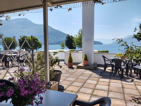 Sky, Plant, Furniture, Property, Table, Flowerpot, Chair, Water, Shade, Lighting
