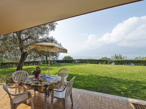 Plant, Sky, Table, Cloud, Property, Furniture, Chair, Umbrella, Natural Landscape, Tree