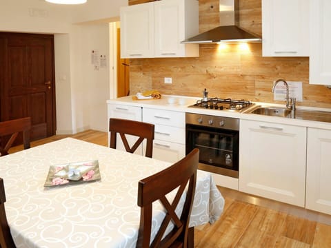 Cabinetry, Countertop, Furniture, Kitchen, Wood, Kitchen Appliance, Home Appliance, Kitchen Stove, Lighting, Interior Design