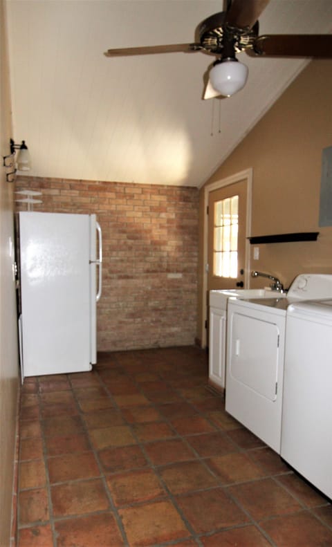 laundry room and extra refrigerator