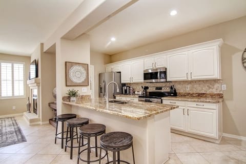 Kitchen island with four stools for entertaining.