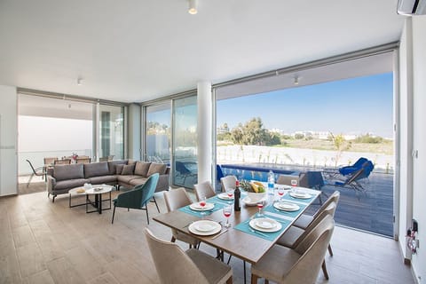 Living Room and Dining Area surrounded by bi-fold patio doors